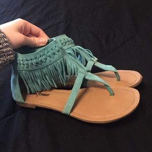 Aqua colored, fringed Minnetonka sandals!